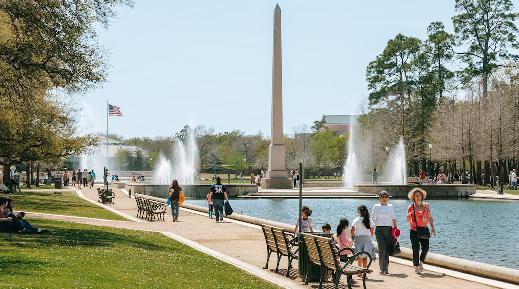 Hermann Park which includes a park, a fountain and a pond