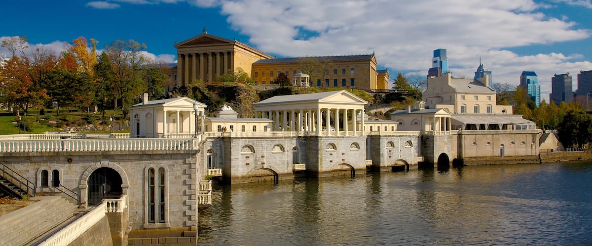 Exploring Fairmount Park along the Schuylkill River in Philadelphia with historic architecture and beautiful greenery