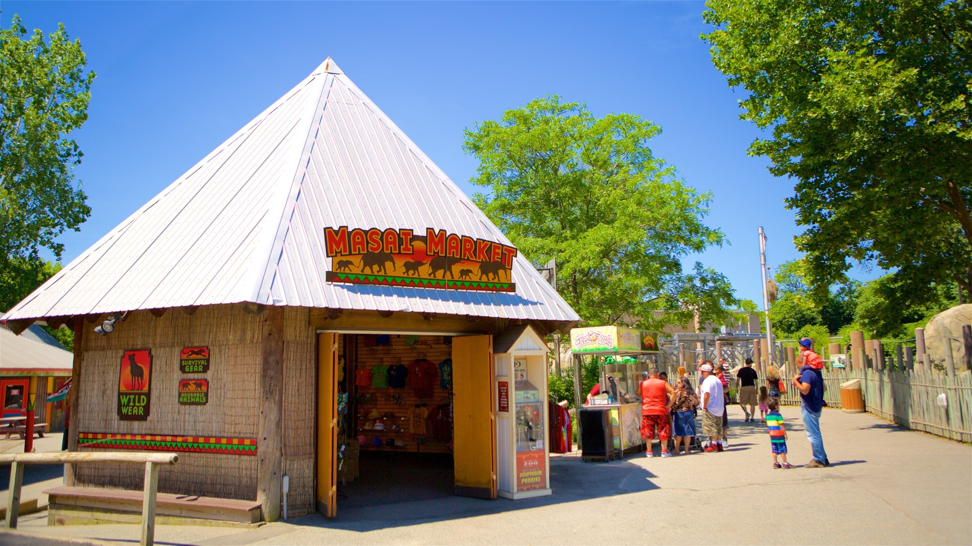 Roger Williams Park Zoo which includes zoo animals and signage as well as a small group of people
