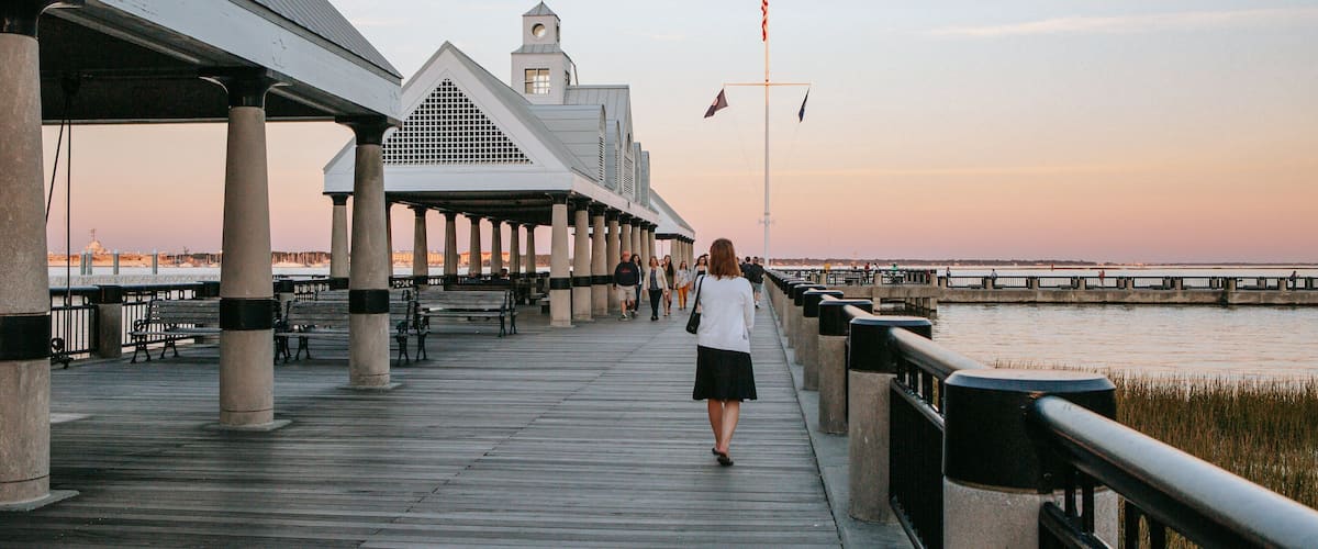 Waterfront Park showing a sunset as well as an individual femail