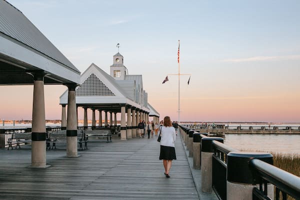 Waterfront Park showing a sunset as well as an individual femail