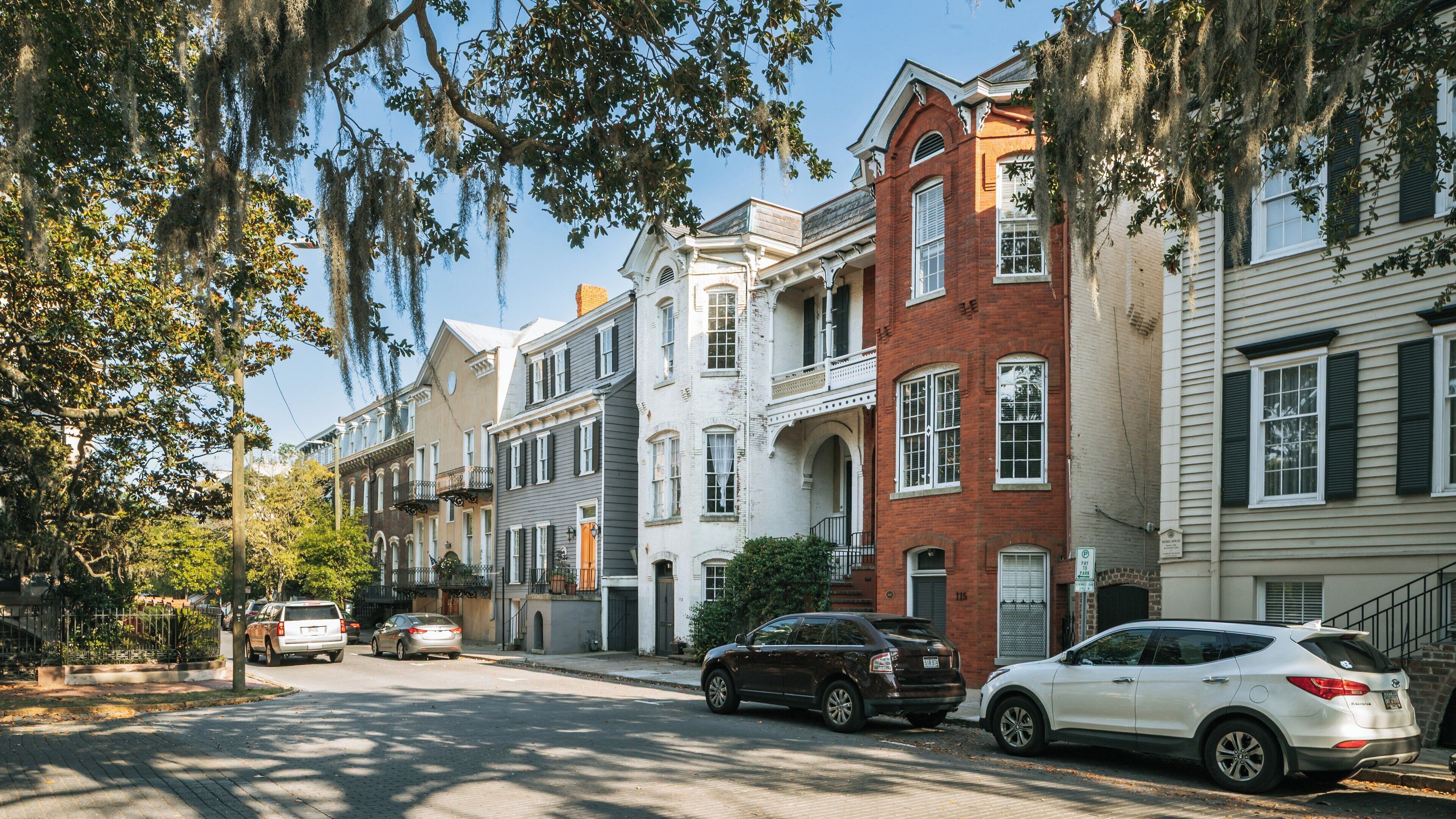 Charming street lined with historic homes in Grant Park, East Side, Atlanta, Georgia, showcasing a sunny day and vibrant neighborhood life