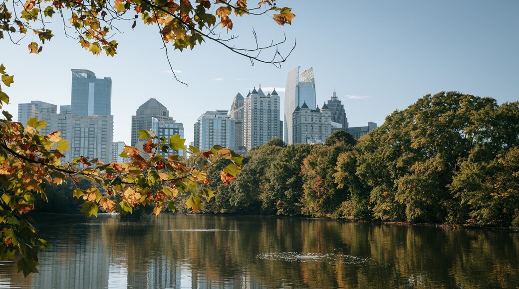 Piedmont Park showing a city and a river or creek