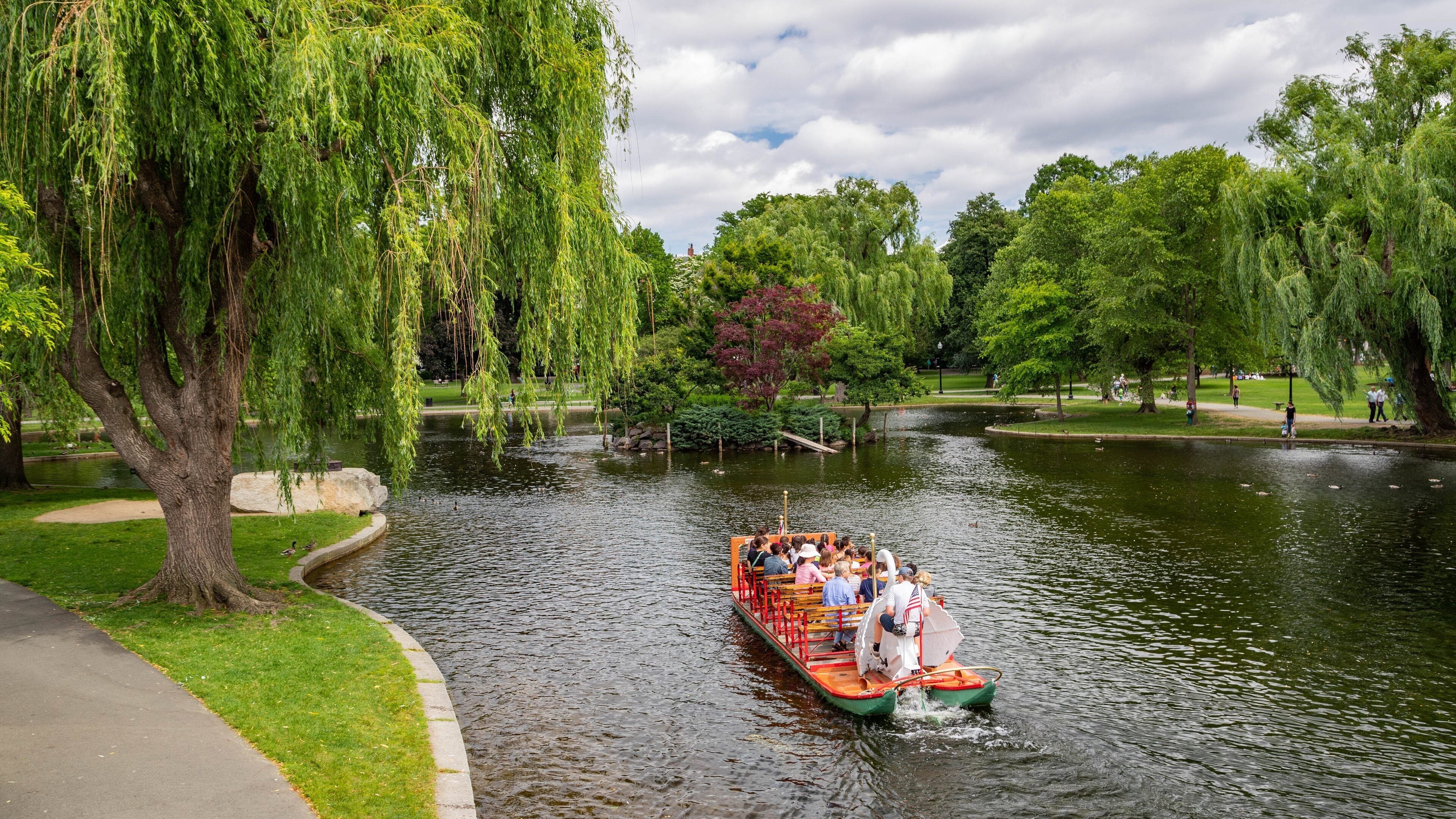Boston Public Garden featuring boating and a pond as well as a small group of people