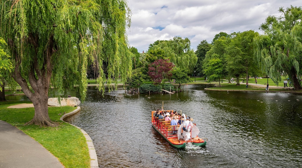 Boston Public Garden featuring boating and a pond as well as a small group of people