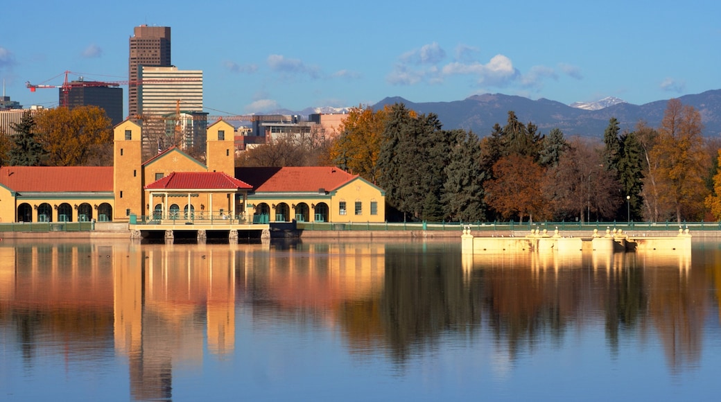 Beautiful autumn view of City Park in Denver, Colorado with serene lake reflections and surrounding mountains