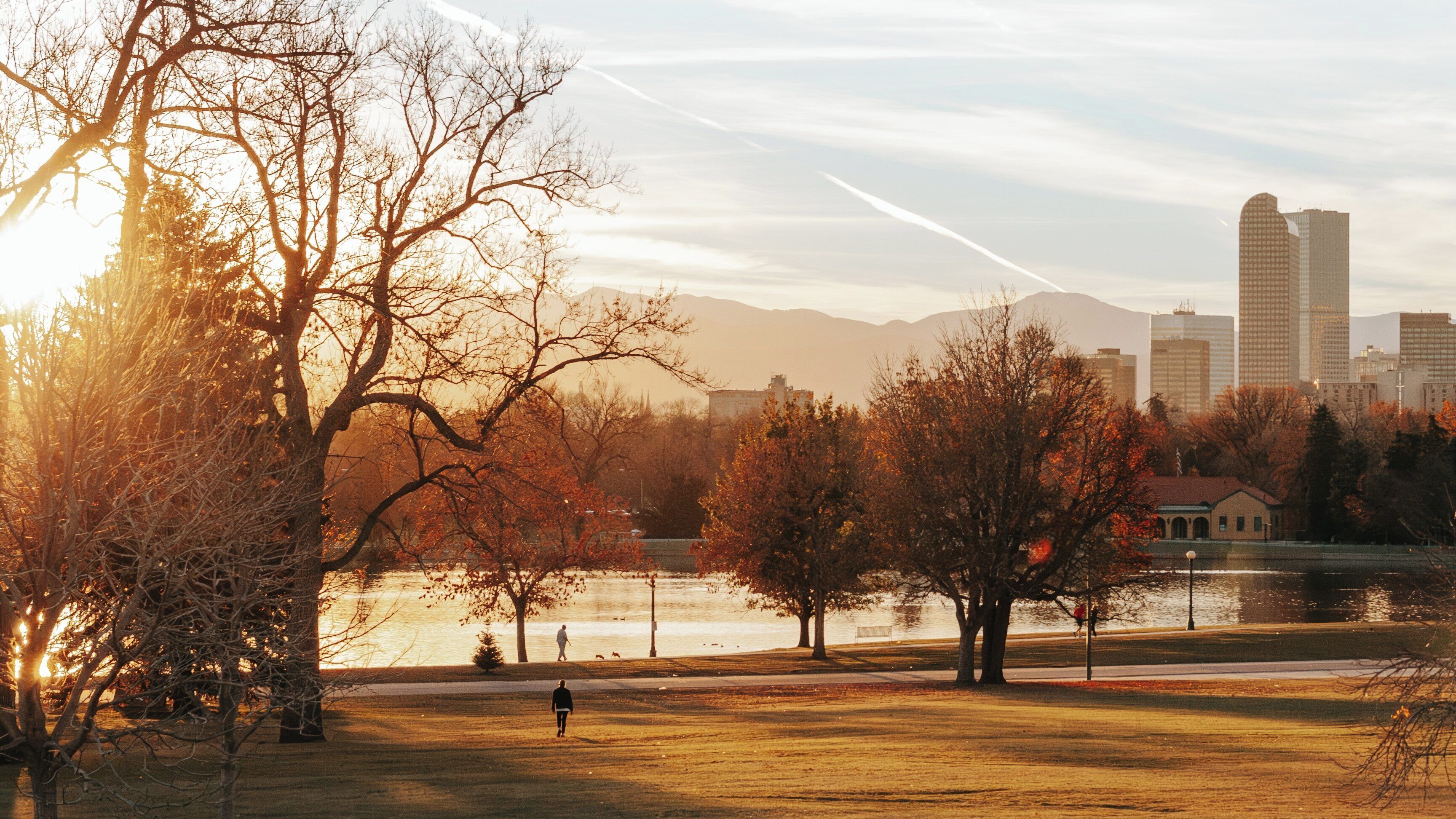 Beautiful autumn evening at City Park in Denver, Colorado, showcasing serene water reflections and city skyline