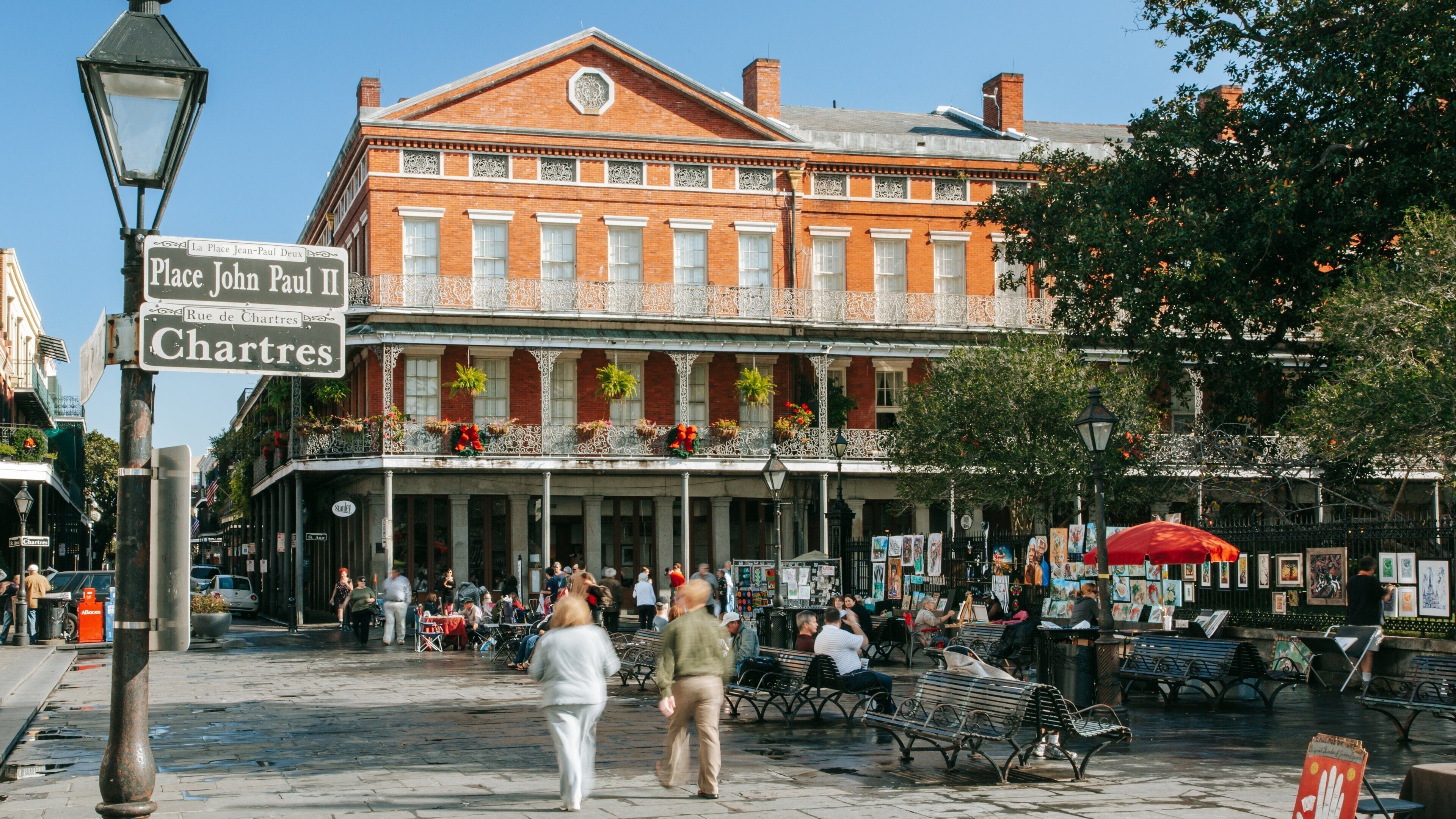 Jackson Square featuring signage and street scenes