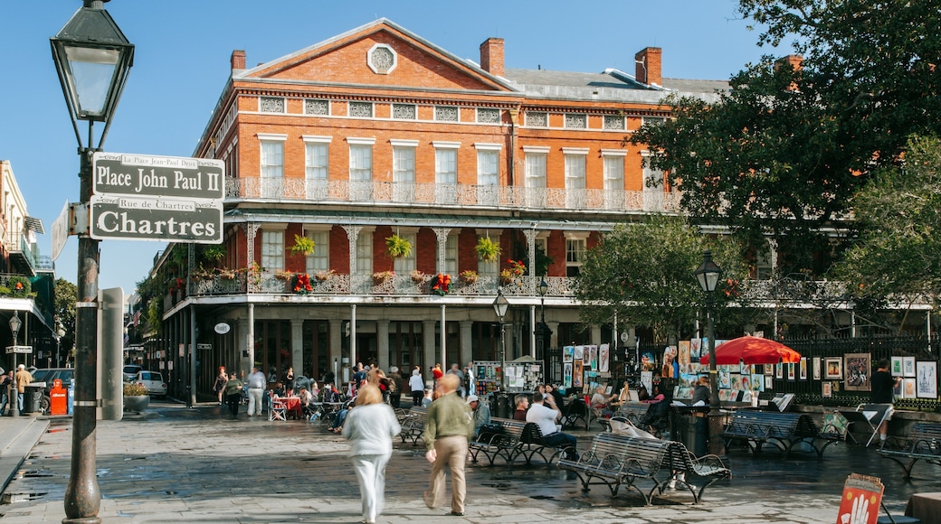 Jackson Square featuring signage and street scenes