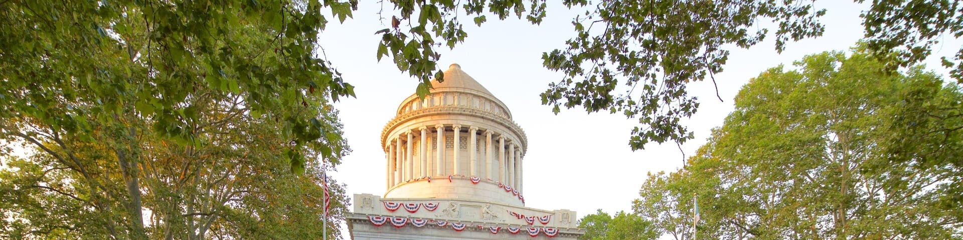 Riverside Park featuring heritage architecture and a square or plaza as well as a large group of people