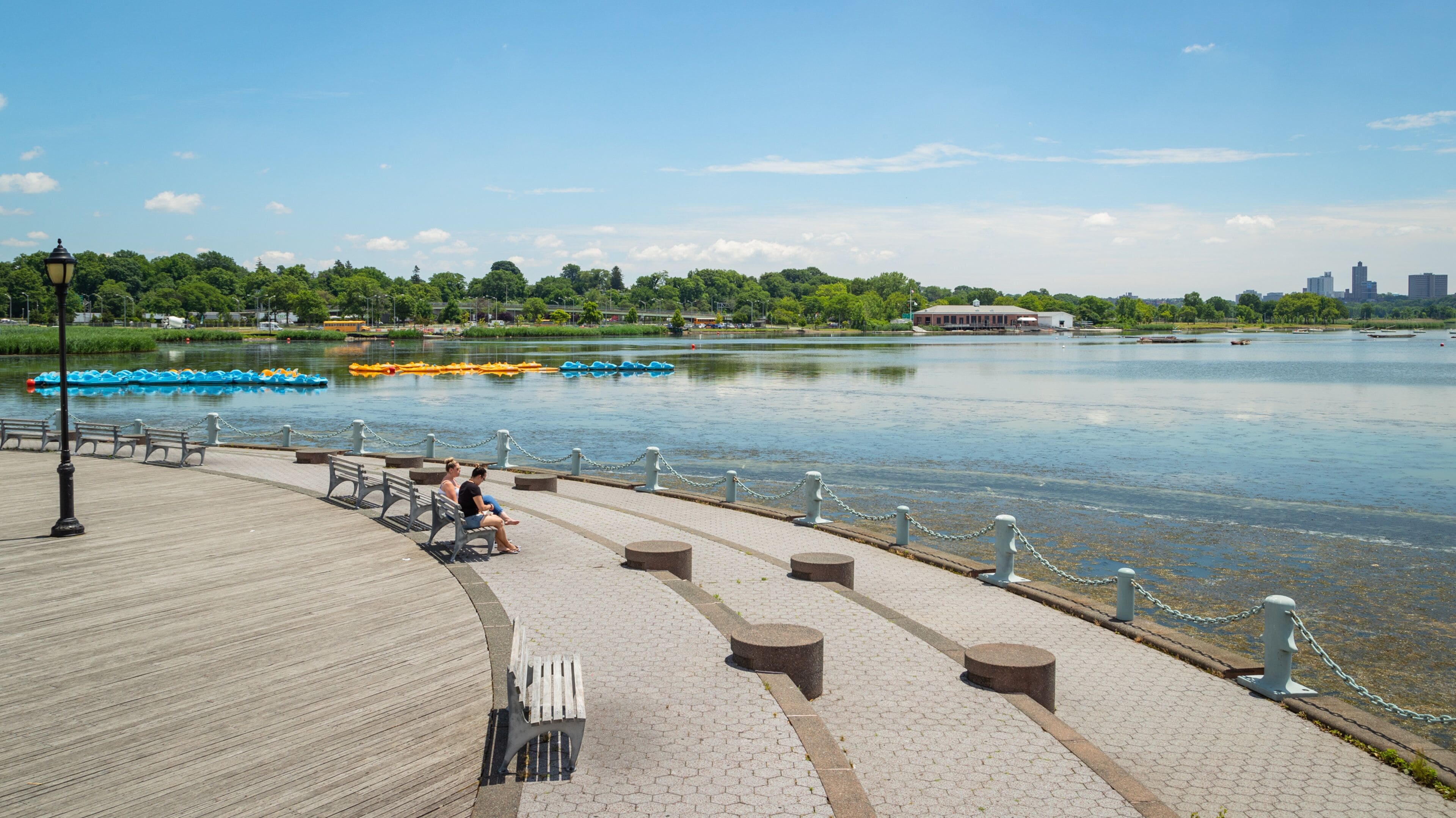Flushing Meadows-Corona Park featuring a lake or waterhole as well as a couple