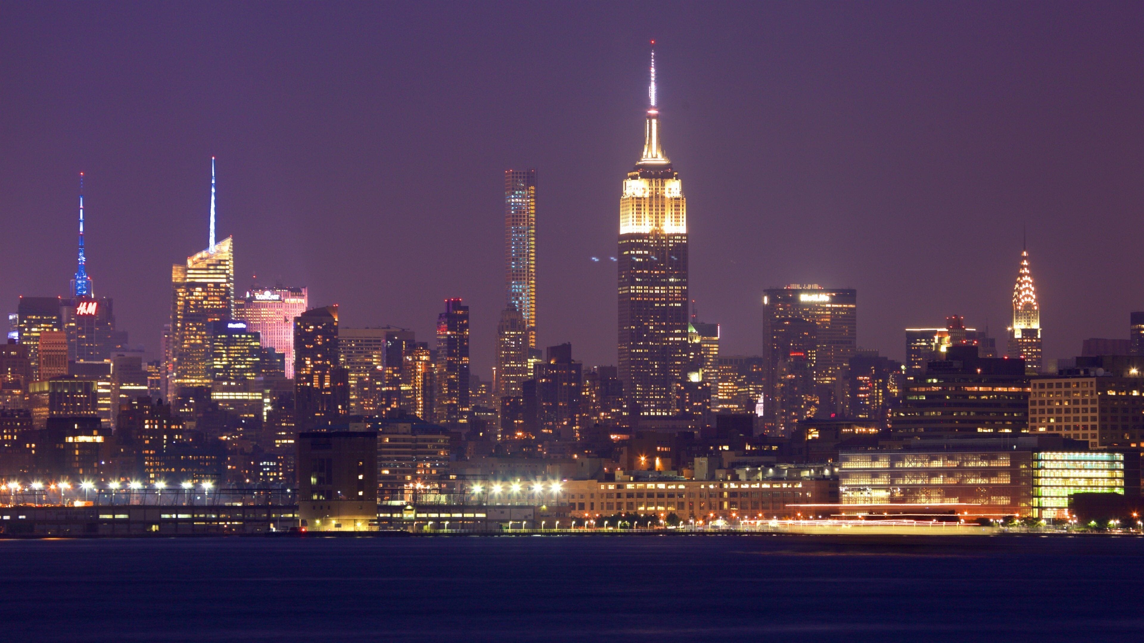 Liberty State Park featuring a river or creek, a high rise building and night scenes