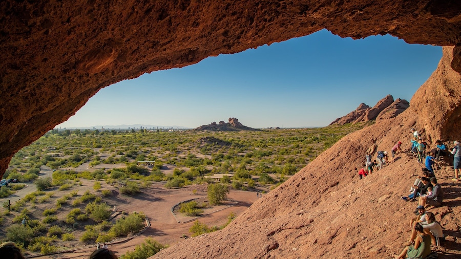 Papago Park featuring desert views as well as a small group of people