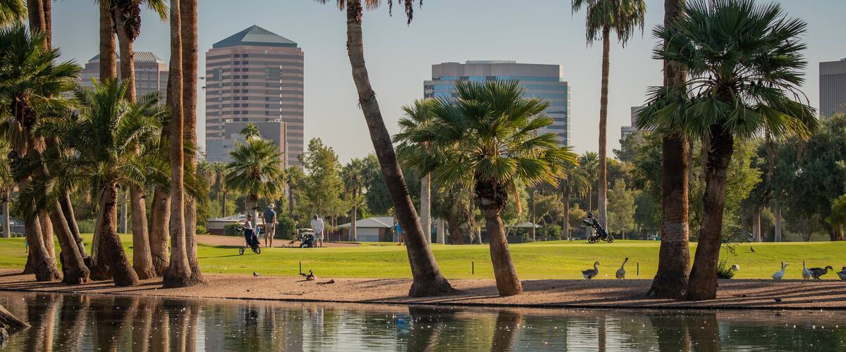 Encanto Park which includes a pond and a park