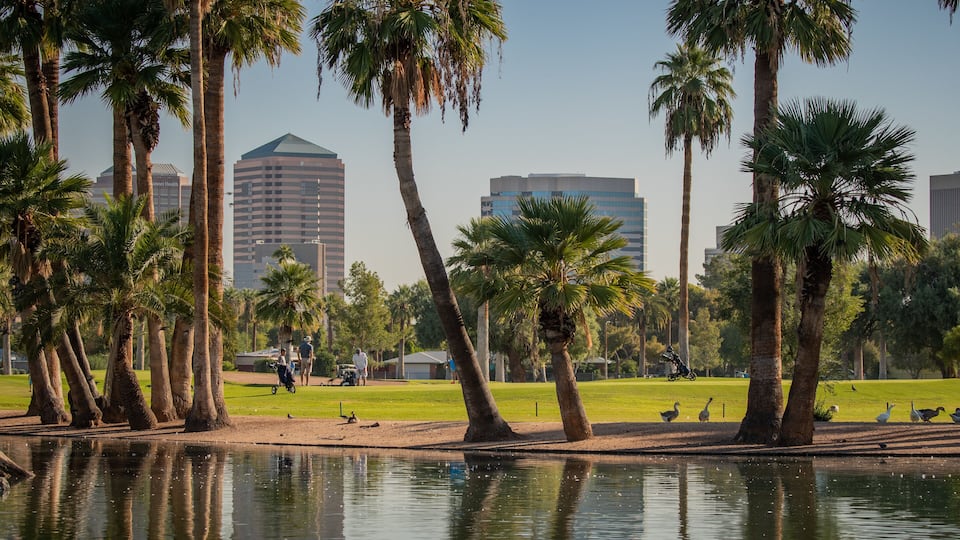 Encanto Park which includes a pond and a park