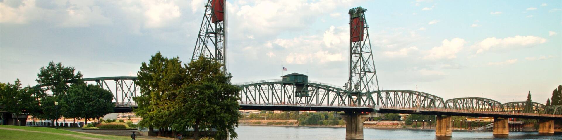Tom McCall Waterfront Park featuring a bridge, bird life and a river or creek