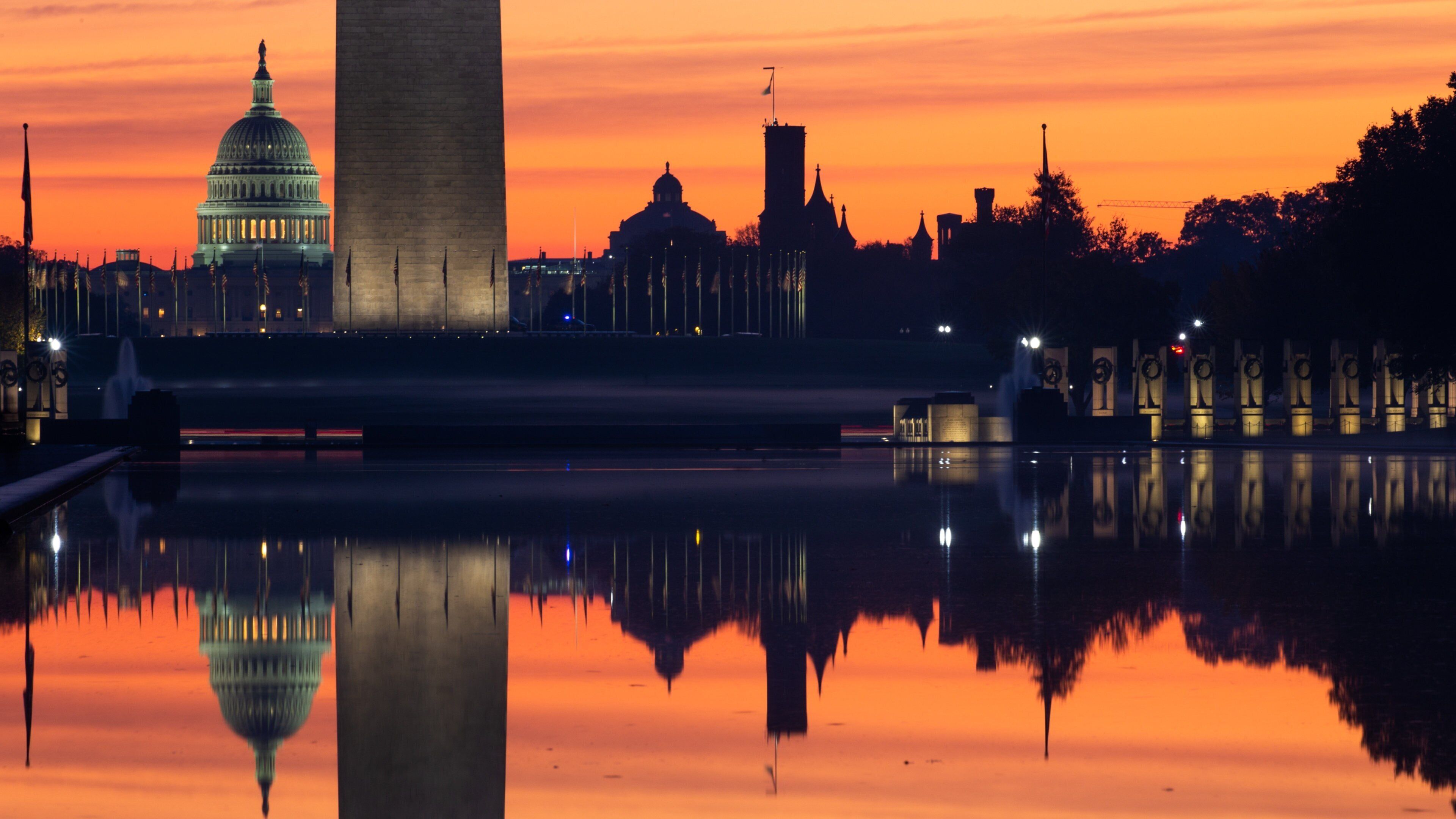 National Mall which includes a sunset and a lake or waterhole