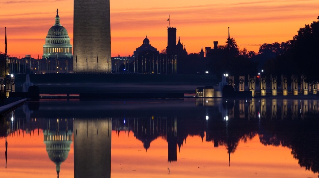 National Mall which includes a sunset and a lake or waterhole
