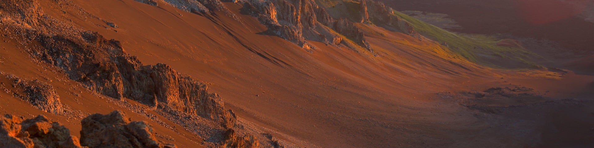 Haleakala National Park showing mountains, a sunset and tranquil scenes