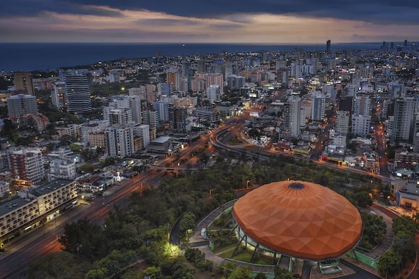Centro Olimpico Juan Pablo Duarte surrounded by buildings in Santo Domingo, the Dominican Republic