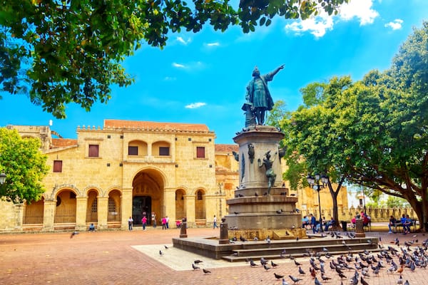 Columbus statue and Basilica Cathedral of Santa Maria la Menor in Santo Domingo Colonial zone. Parque Colon