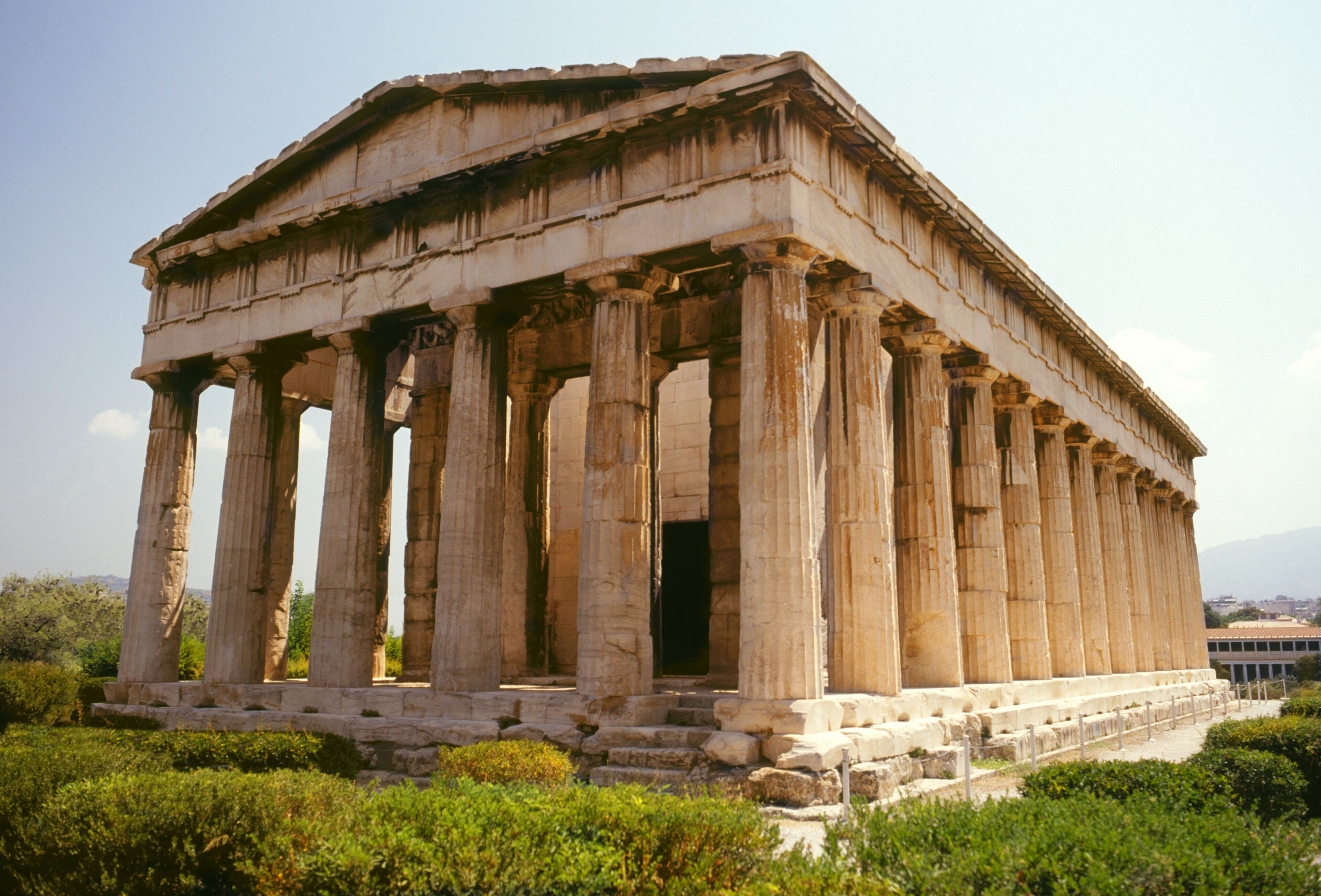 An ancient Greek temple with Doric columns and a rectangular structure.