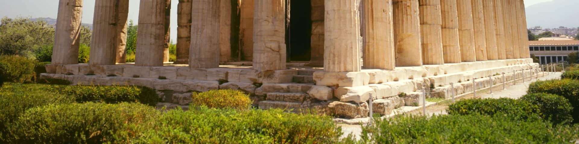 An ancient Greek temple with Doric columns and a rectangular structure.