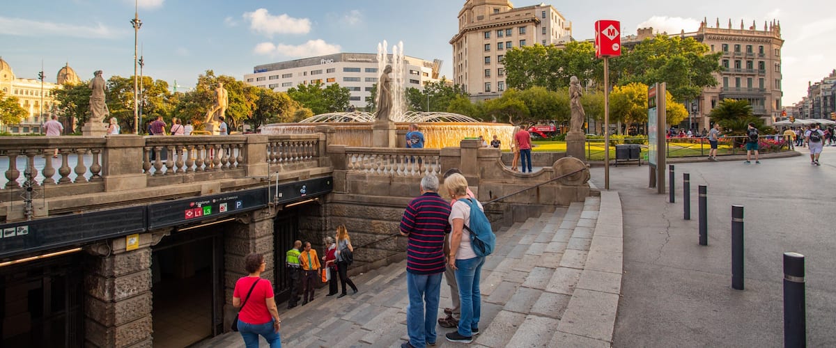 Placa de Catalunya showing a city and street scenes as well as a small group of people