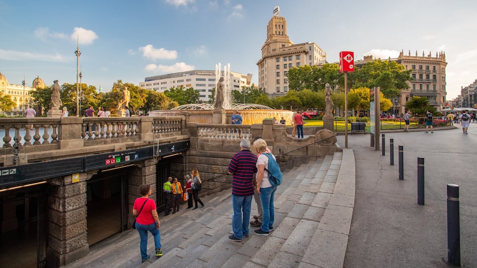 Placa de Catalunya showing a city and street scenes as well as a small group of people
