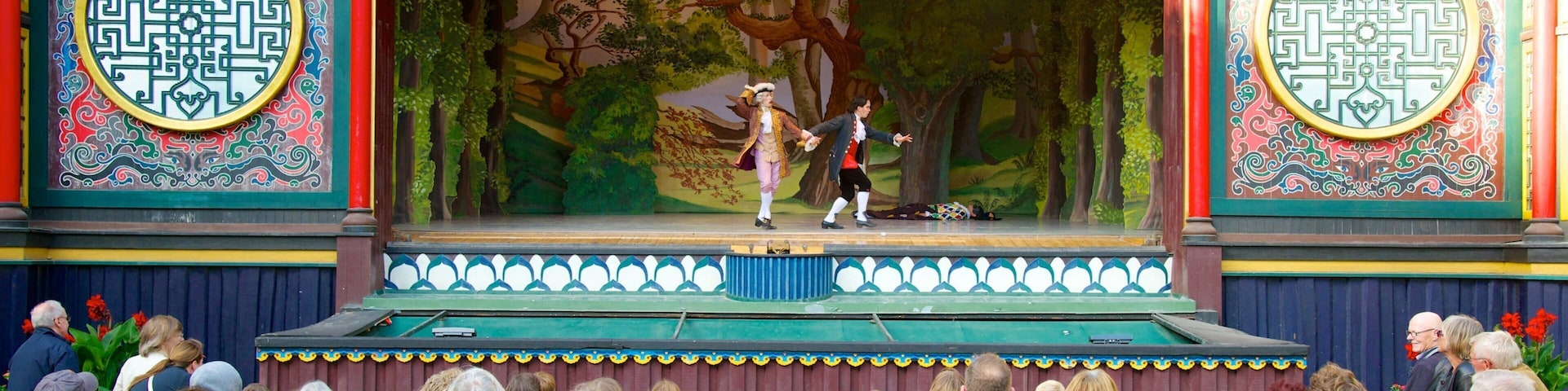 Tivoli Gardens featuring theater scenes, performance art and rides