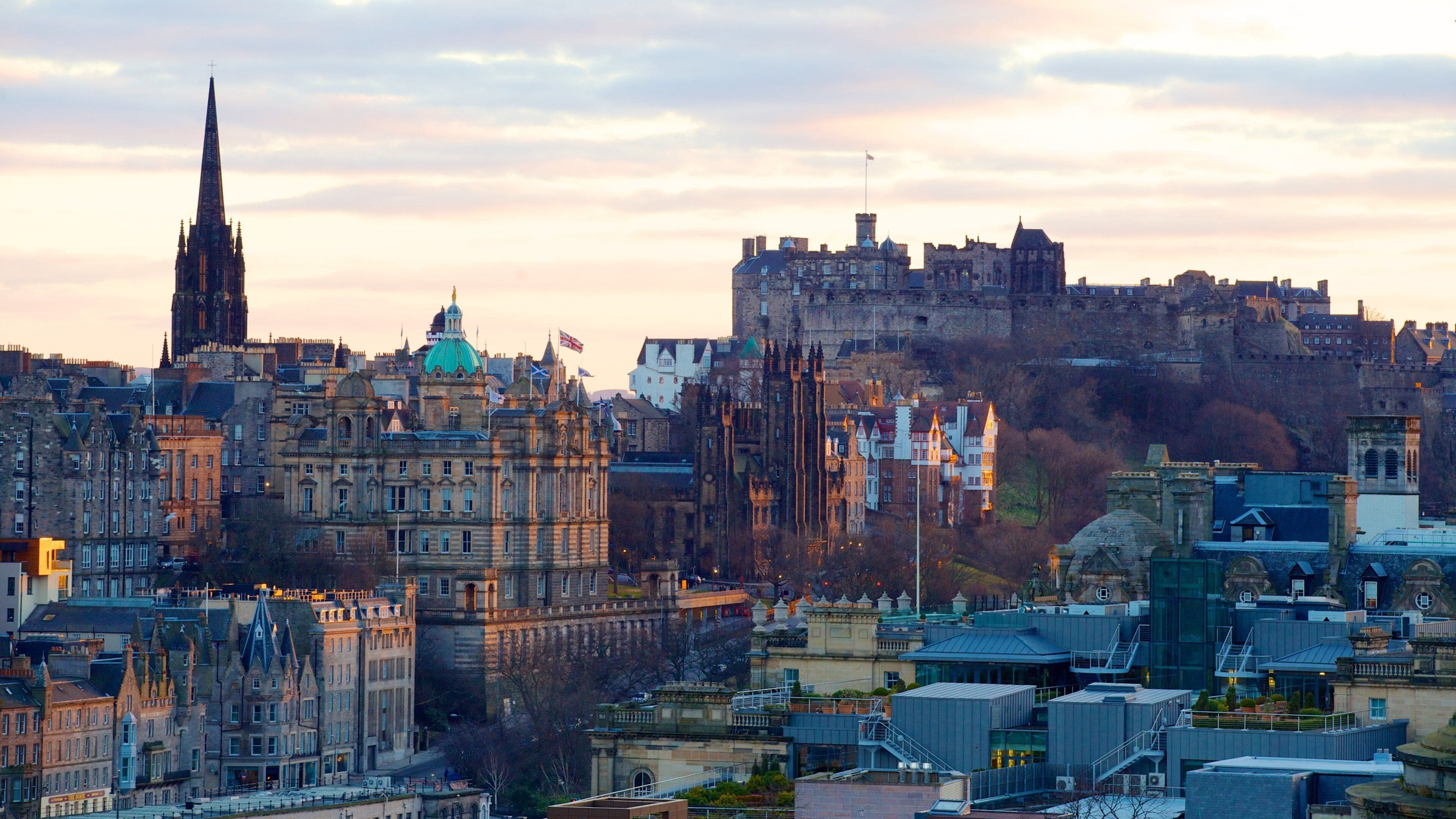 Calton Hill which includes a sunset, skyline and a city