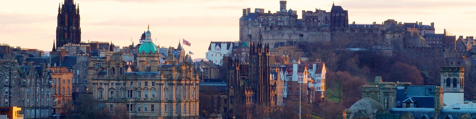 Calton Hill which includes a sunset, skyline and a city