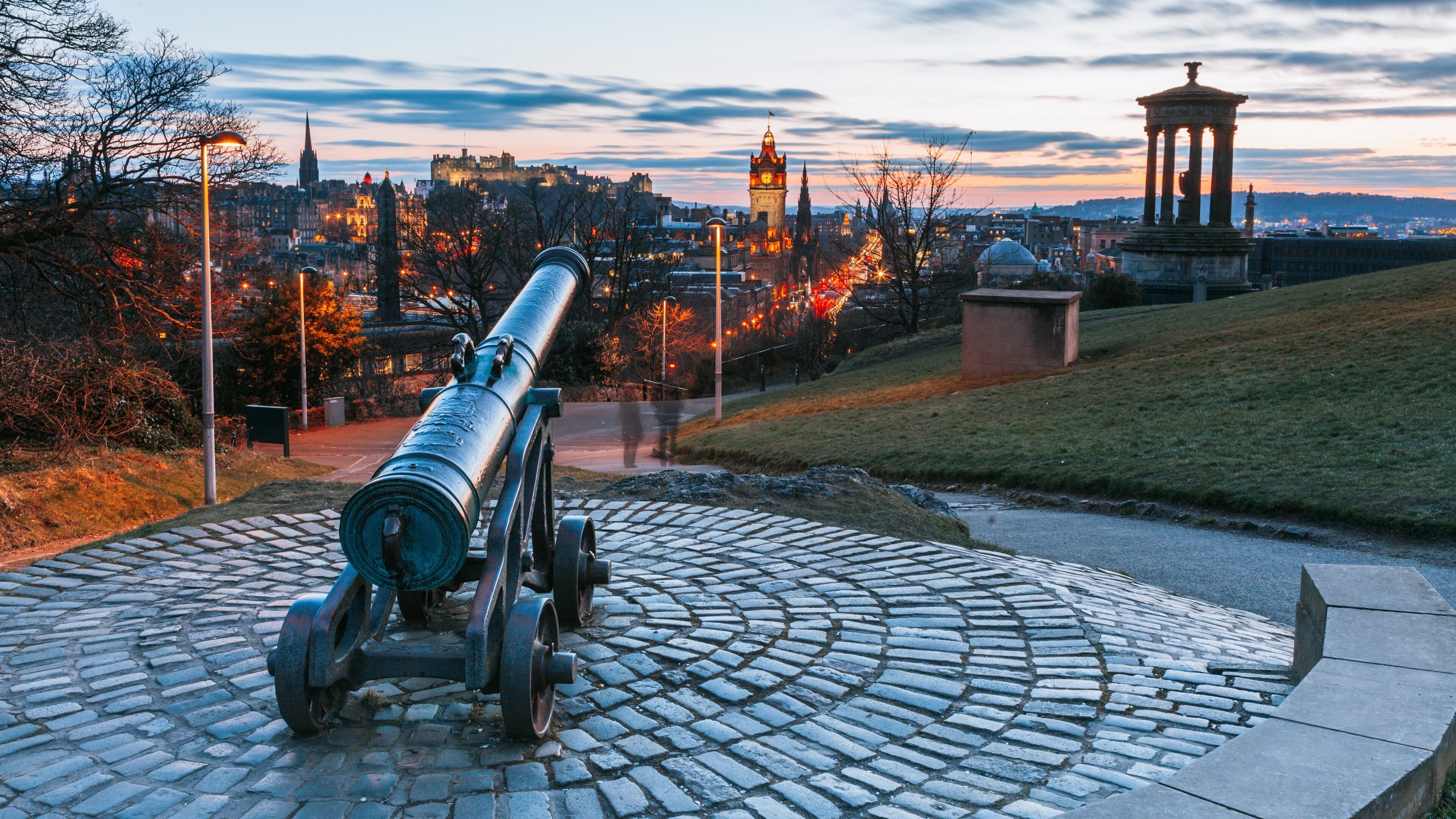 Calton Hill featuring heritage elements, a sunset and a garden