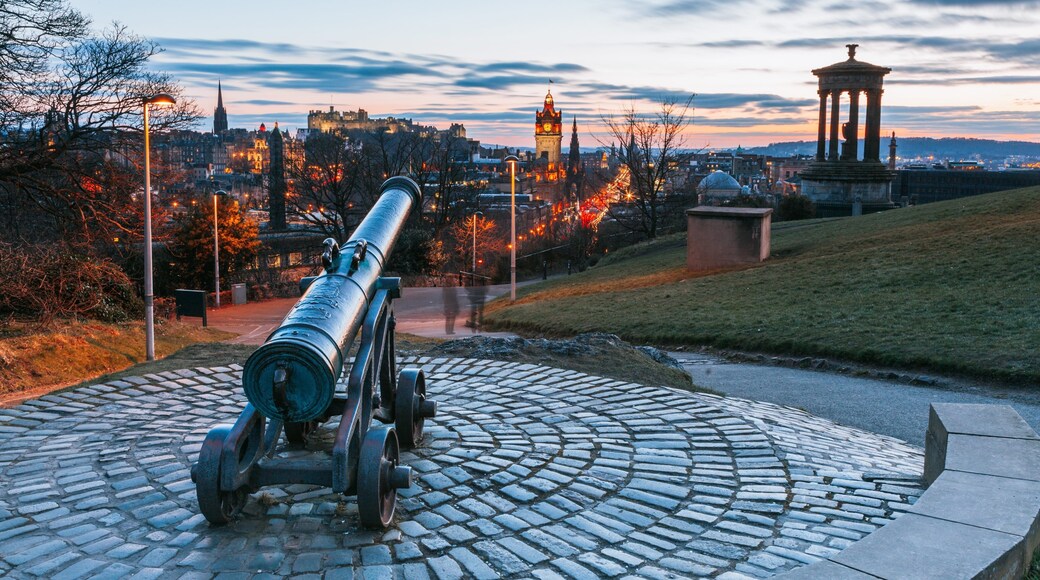 Calton Hill featuring heritage elements, a sunset and a garden