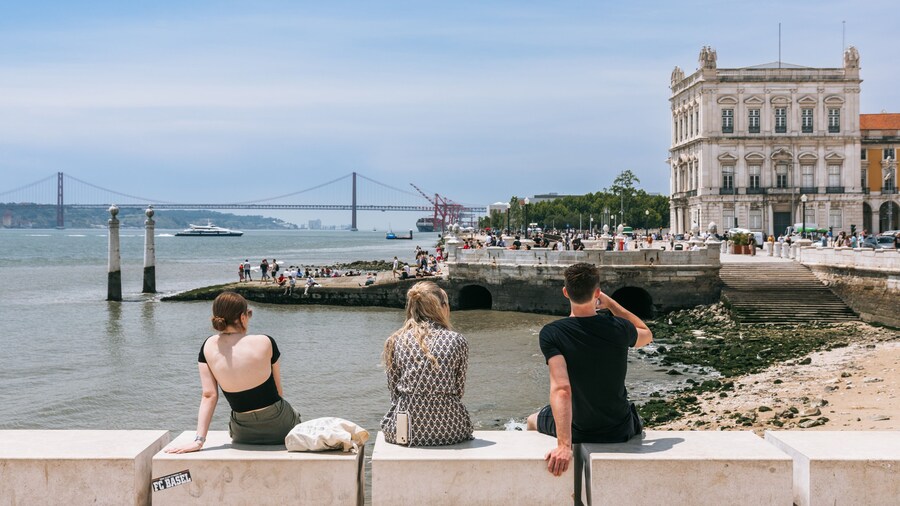 Commerce Square featuring a bay or harbor as well as a small group of people