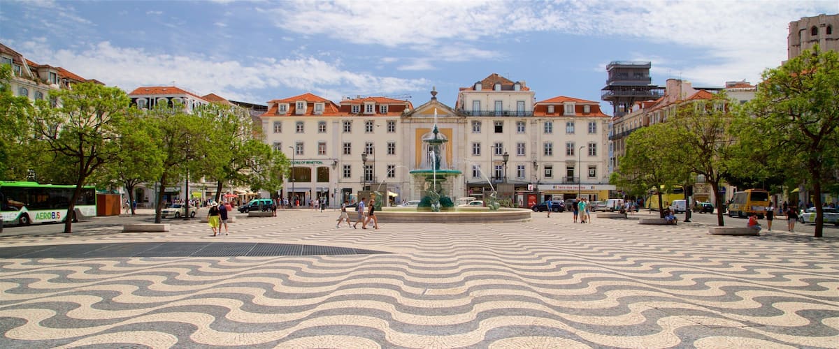 Rossio Square which includes a fountain and a square or plaza