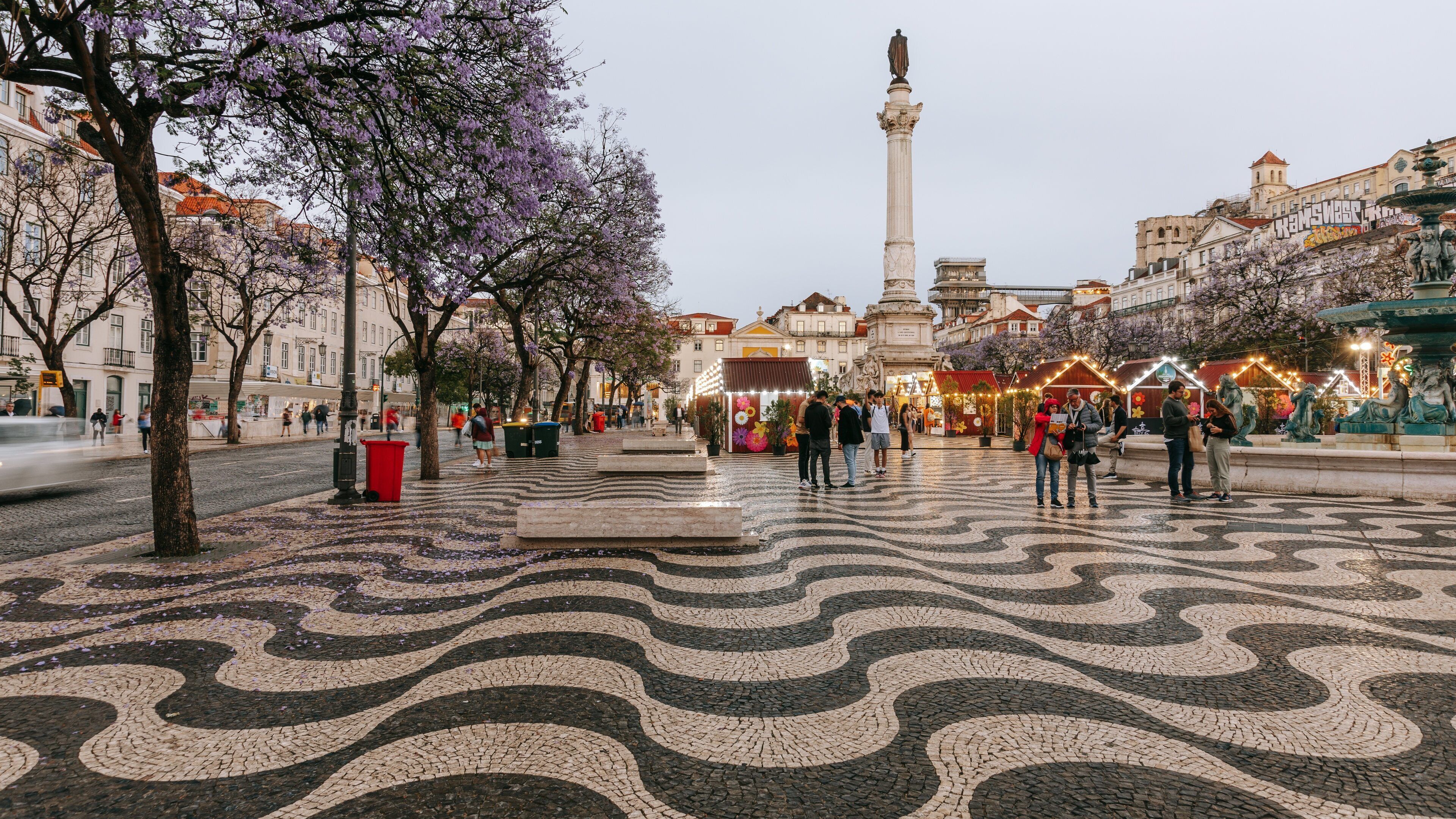 Rossio Square featuring a statue or sculpture and a square or plaza