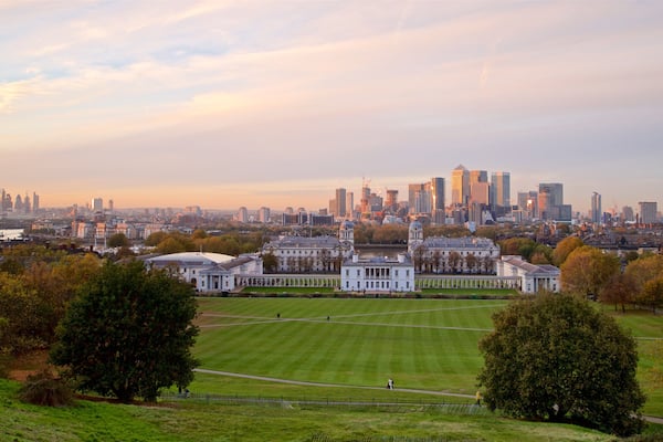 A cityscape with a large park, historic buildings, and a modern skyline.