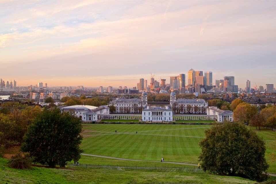 A cityscape with a large park, historic buildings, and a modern skyline.