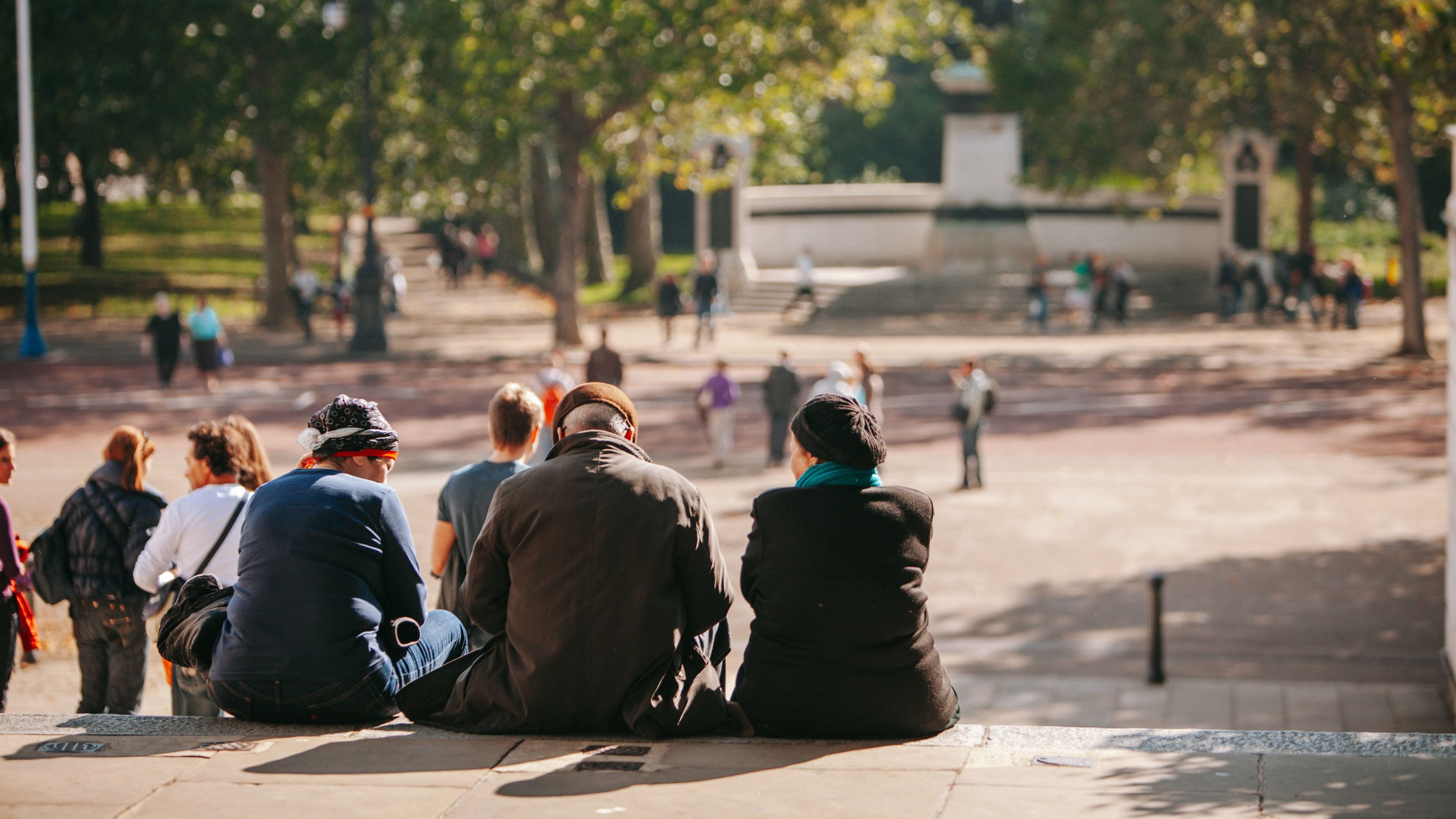 St. James Park showing a park as well as a small group of people