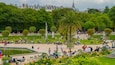 Luxembourg Gardens showing a garden as well as a large group of people
