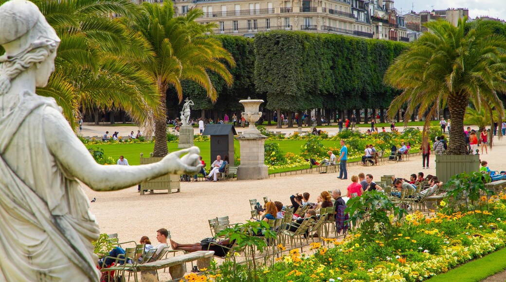 Luxembourg Gardens featuring flowers, a statue or sculpture and a garden