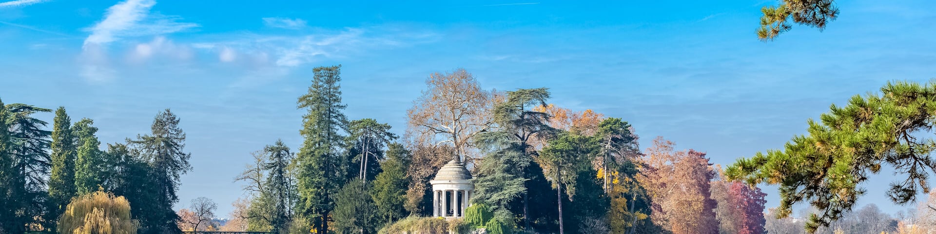 Vincennes, the temple of love and artificial grotto on the Daumesnil lake, in the public park, in autumn