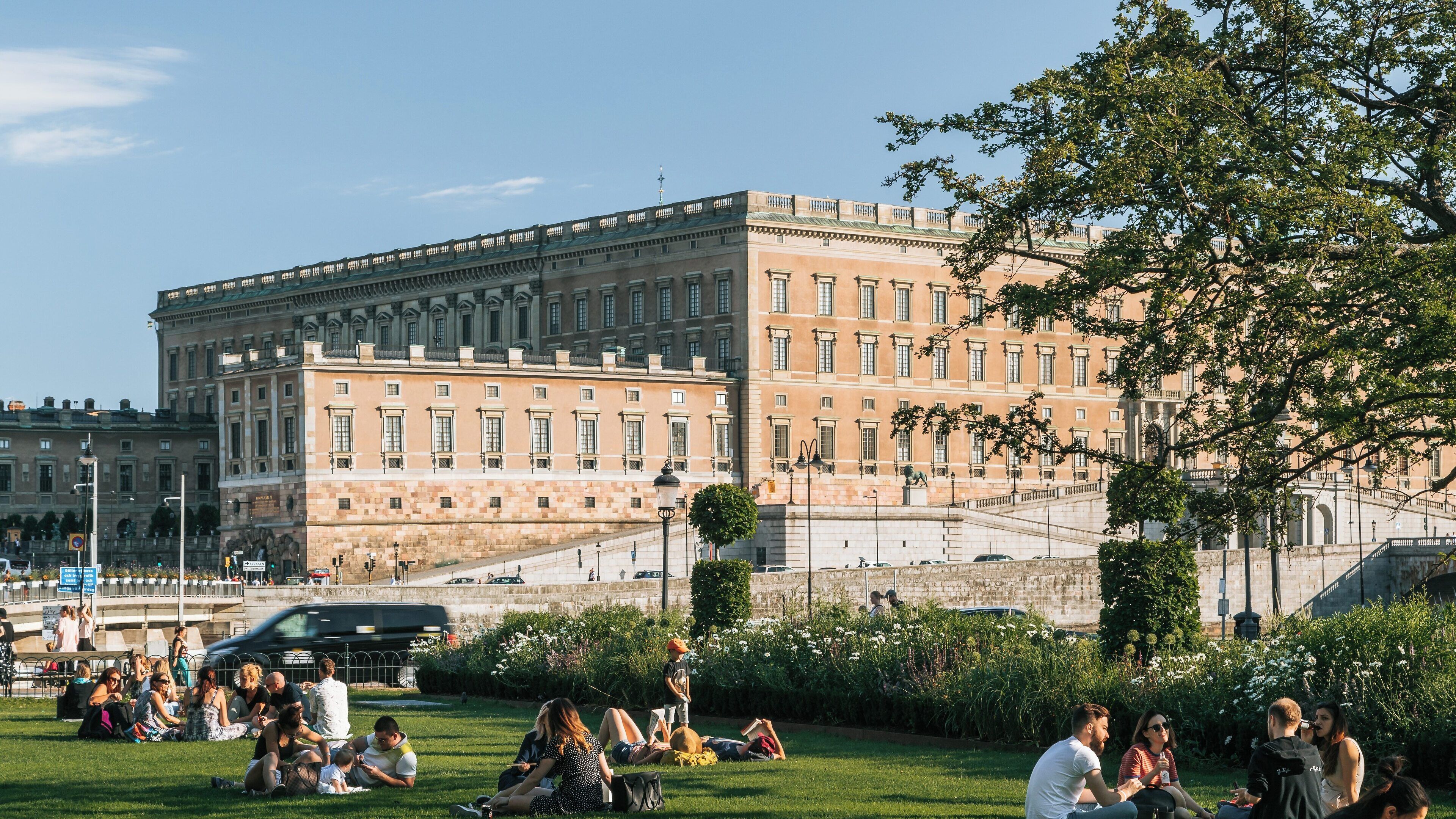 Relaxing afternoon at King's Garden in Central Stockholm with visitors enjoying the sun and beautiful scenery