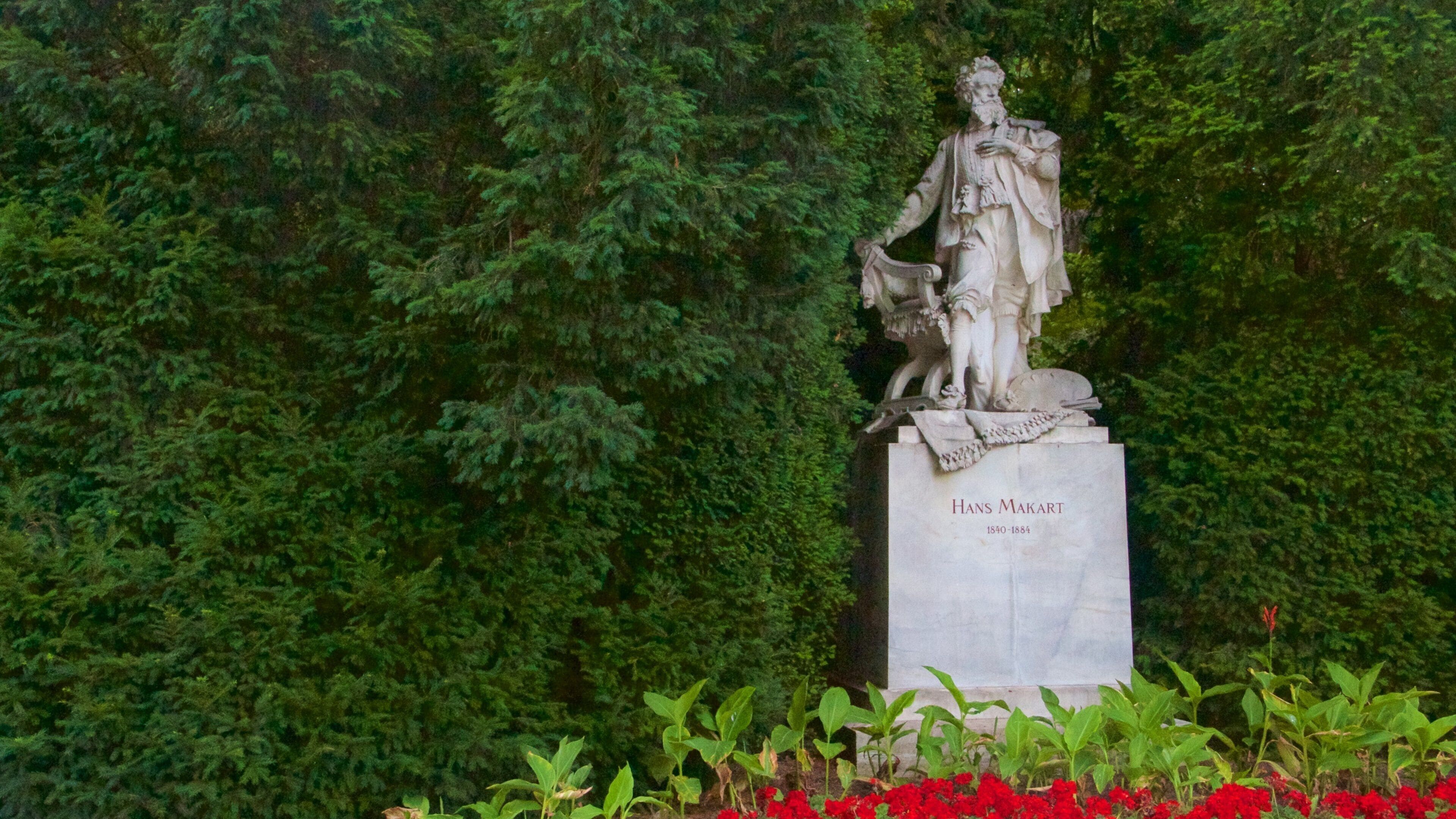 Wiens Bypark som viser en park og en statue eller en skulptur