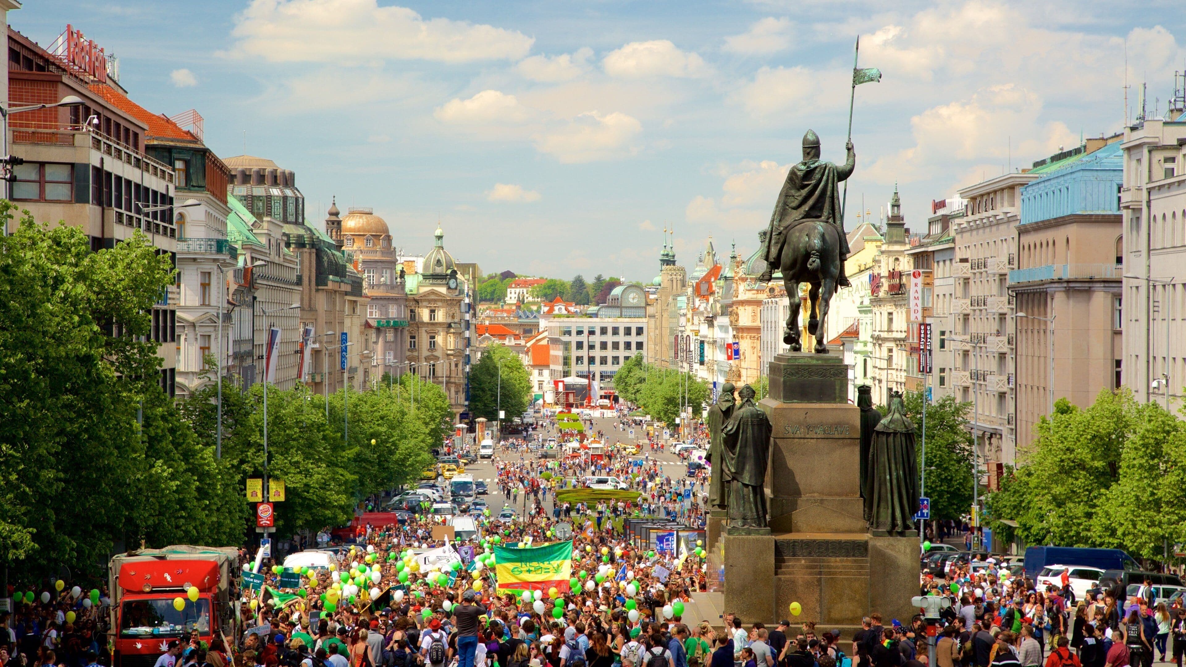 Wenceslas Square which includes a statue or sculpture, street scenes and a city