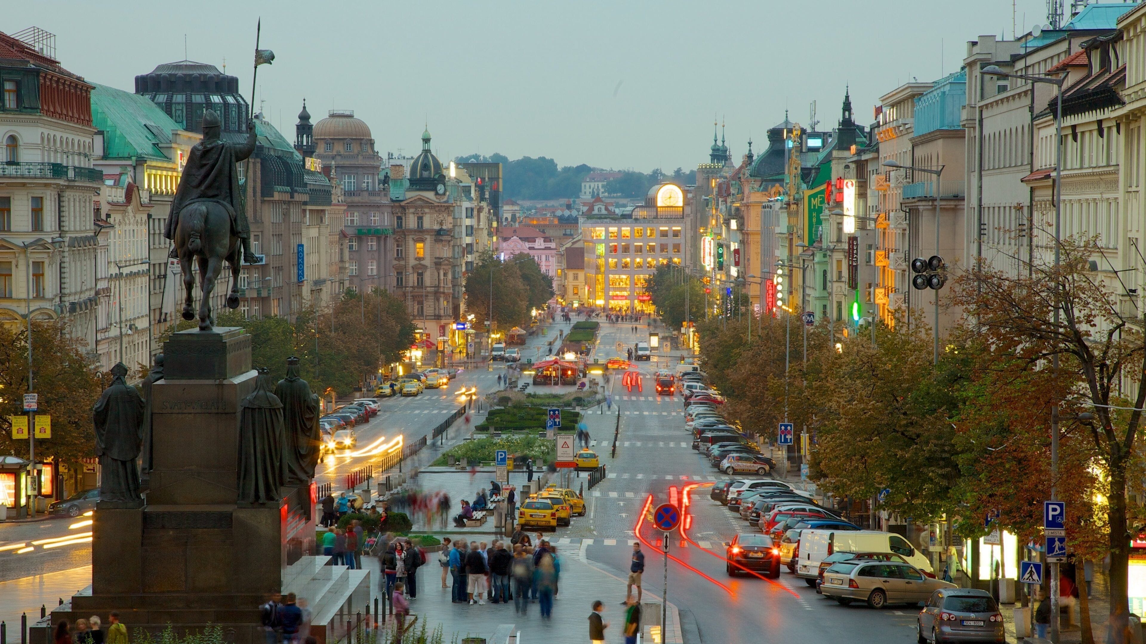 Wenceslas Square which includes a monument, a city and a statue or sculpture