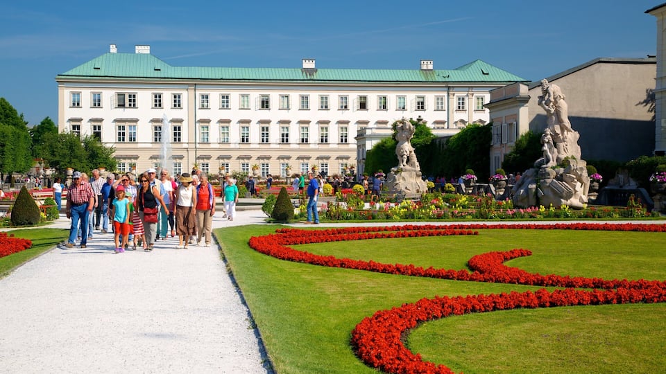 Mirabell Palace and Gardens featuring heritage architecture, flowers and a city