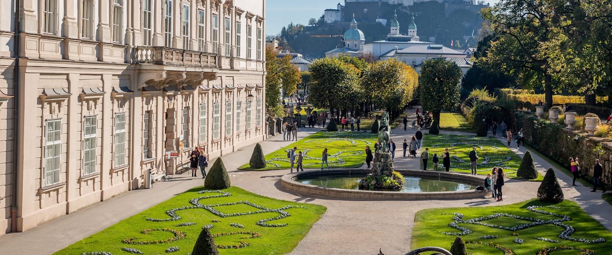 Mirabell Palace and Gardens showing heritage architecture, a statue or sculpture and a fountain