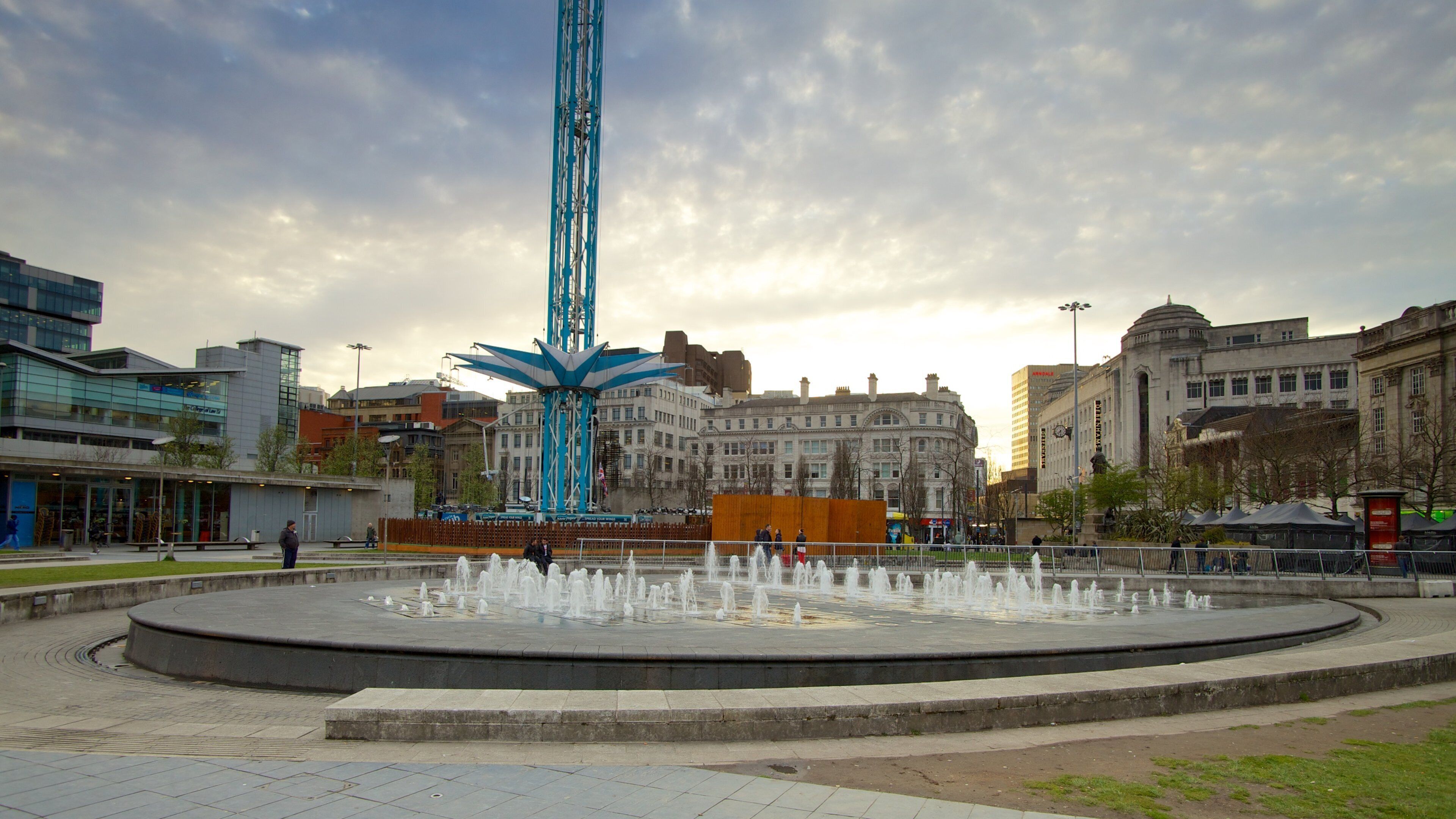Piccadilly Gardens showing a square or plaza, a fountain and a city